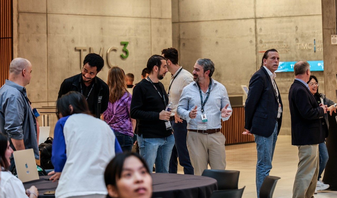 People stand in the lobby of TMC3