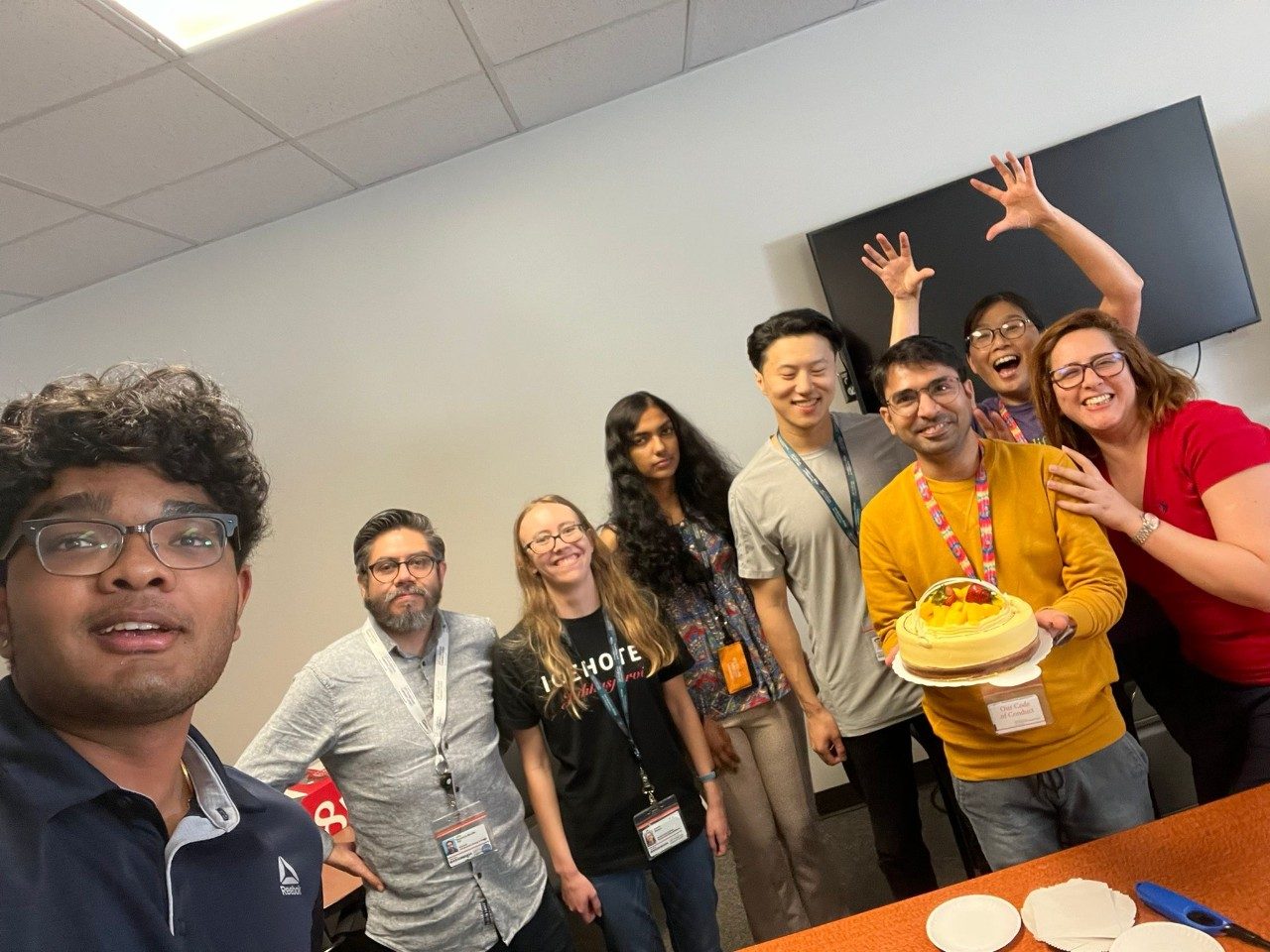 Selfie of lab members, with one holding a birthday cake