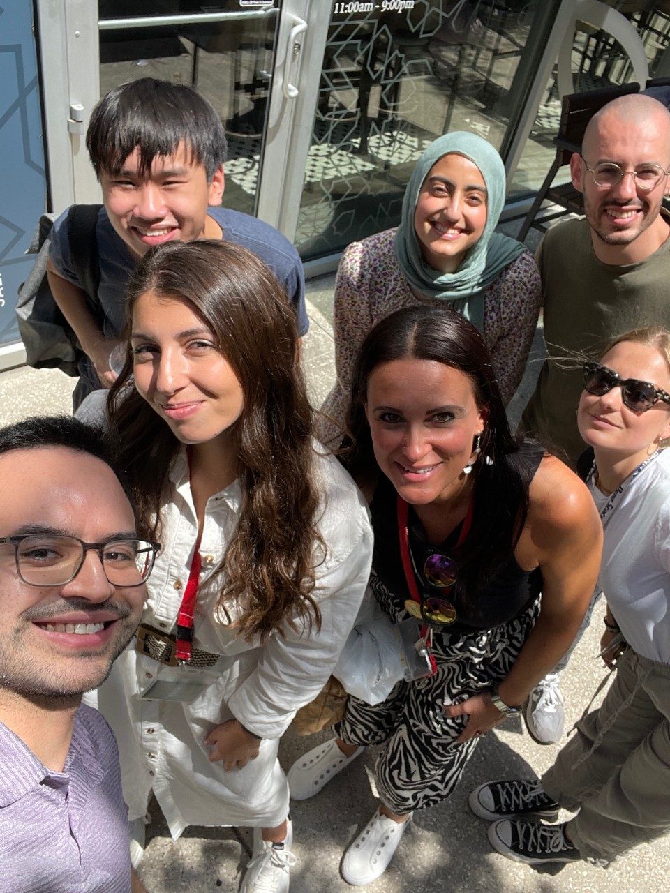 7 lab members posing for a selfie outside