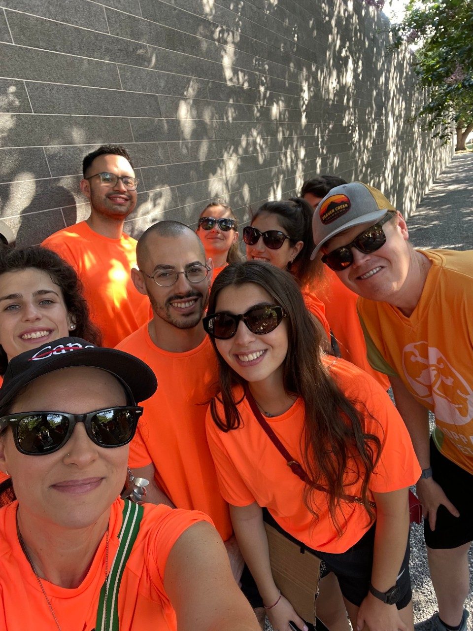 Self of the team in neon orange matching t-shirts
