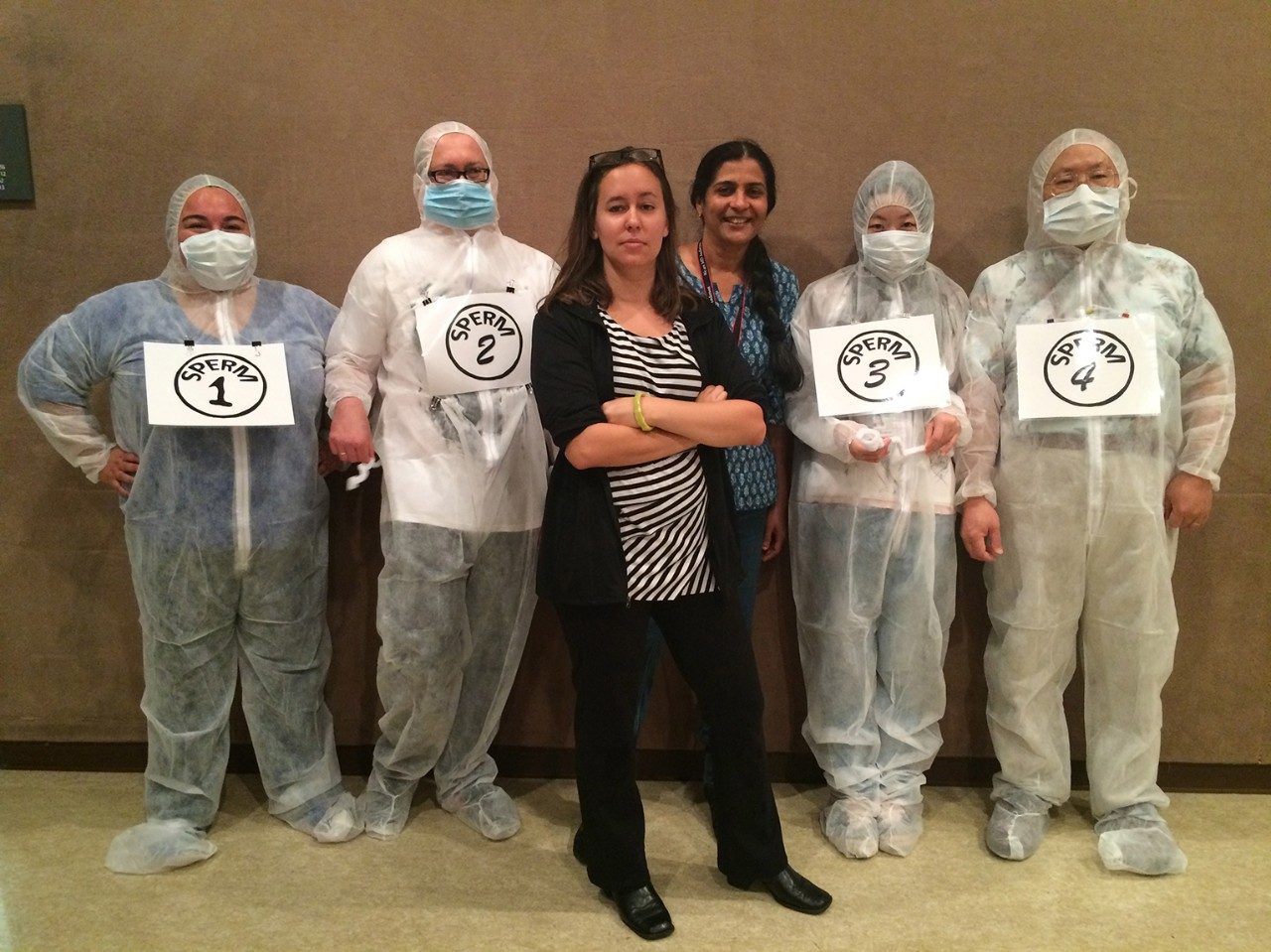 Six people pose in costumes