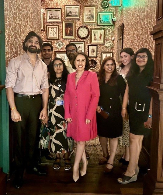 Dr. Goswami center with her lab during an outing