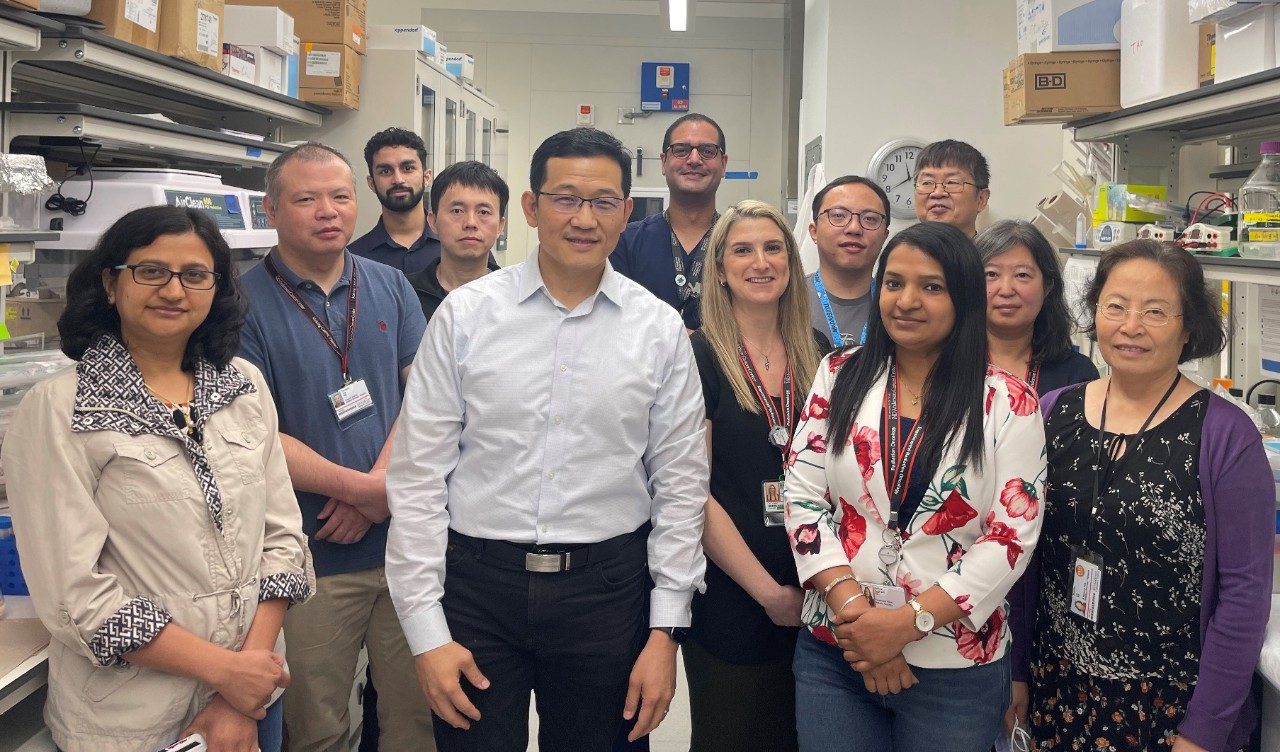 People pose in a lab