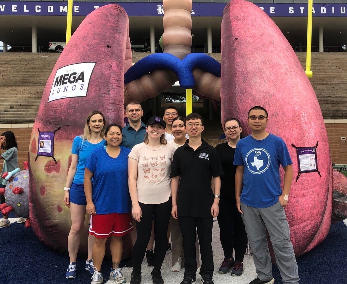 Mazur group standing in front of giant inflatable lungs