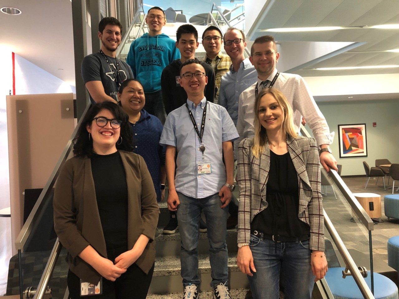 Mazur group posed on a staircase