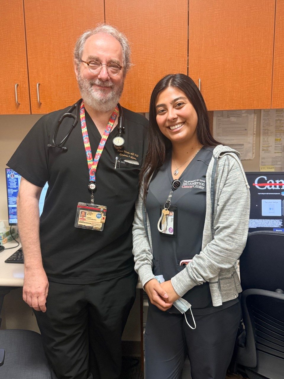 Dr. Orlowksi posing with lab member