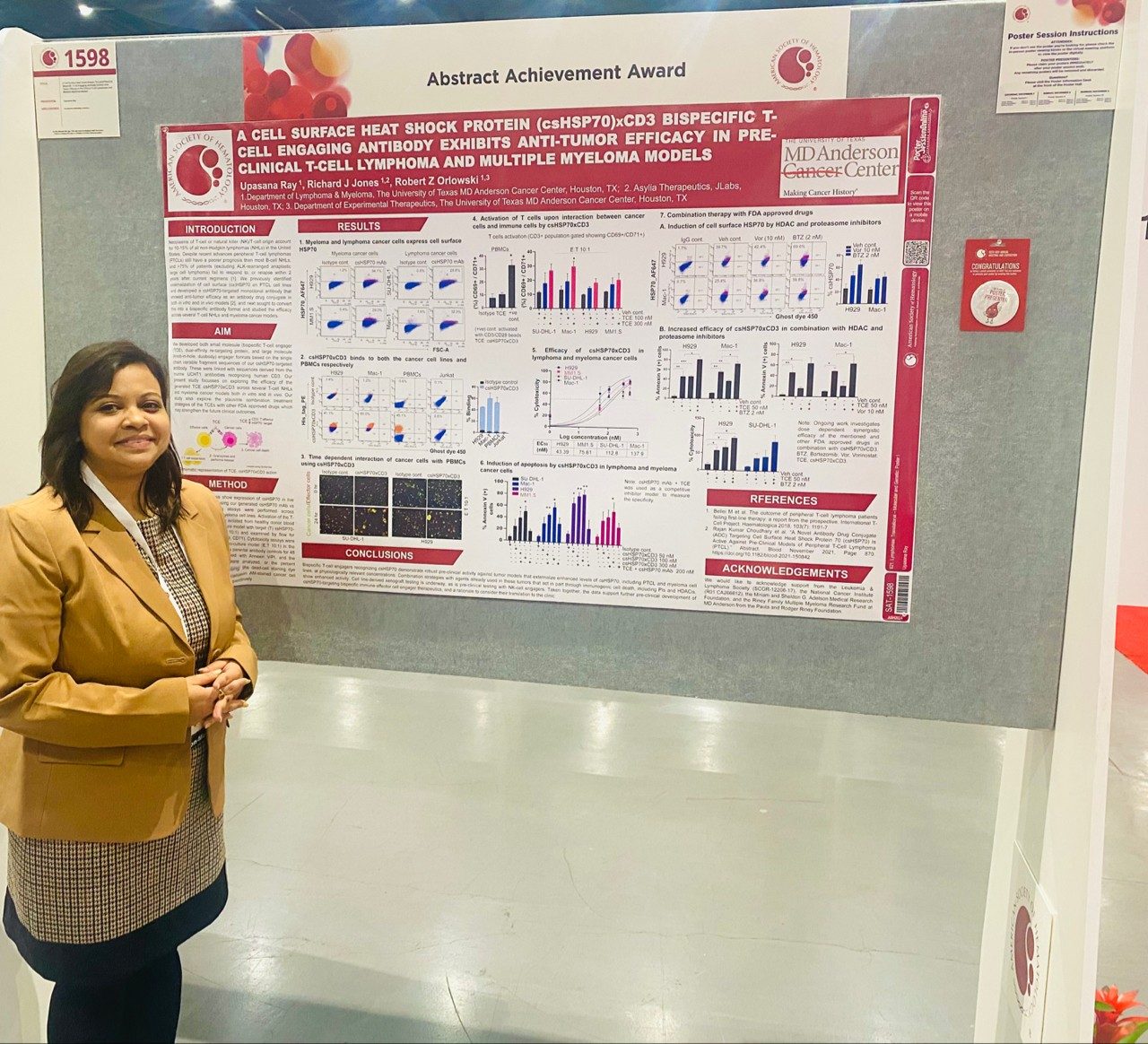 Woman posing with poster