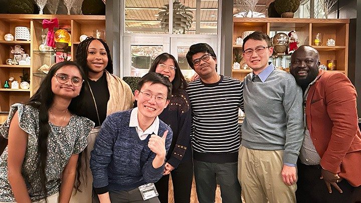 Photo of Pan Lab members at the department of Symptom Research holiday party