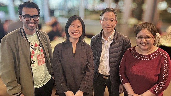 Photo of Pan Lab members attending the department of Symptom Research winter holiday party.