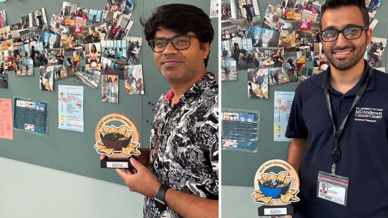 Photo of Symptom Research salsa contest winners Anand Singh and Khalil Kasm holding their trophies.