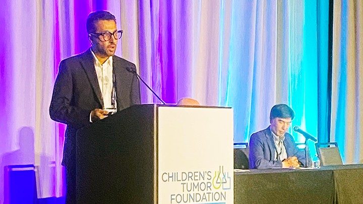 Photo showing Pan Lab member Khalil Kasm making an oral presentation at the Children's Tumor Foundation neurofibromatosis conference in June 2026