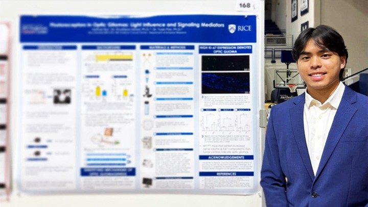 Photo of Pan Lab member Nathan Bui beside a research poster