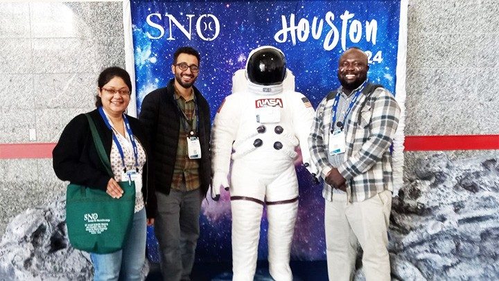 Nov 2024: Pan Lab members (Khushboo Irshad, Khalil Kasm, Benjamin Aghoghovwia) and a Houston astronaut "mascot" at the 2024 Society for Neuro-Oncology Annual Meeting in Houston