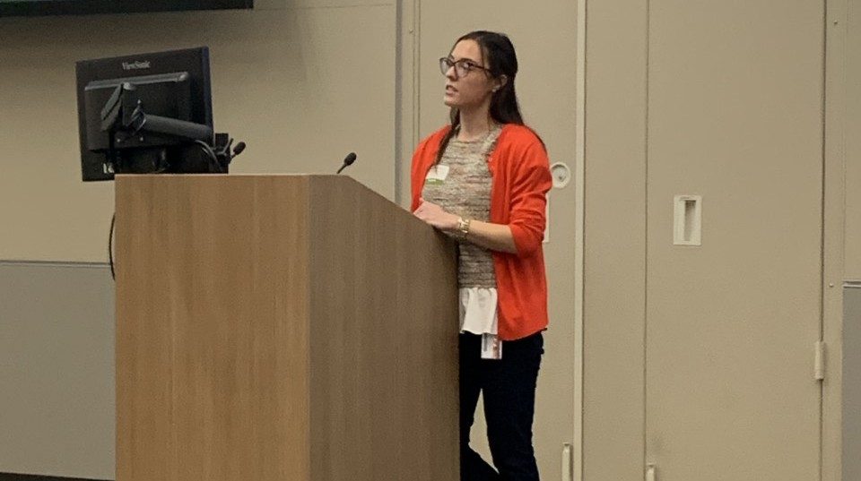 Woman standing at a podium