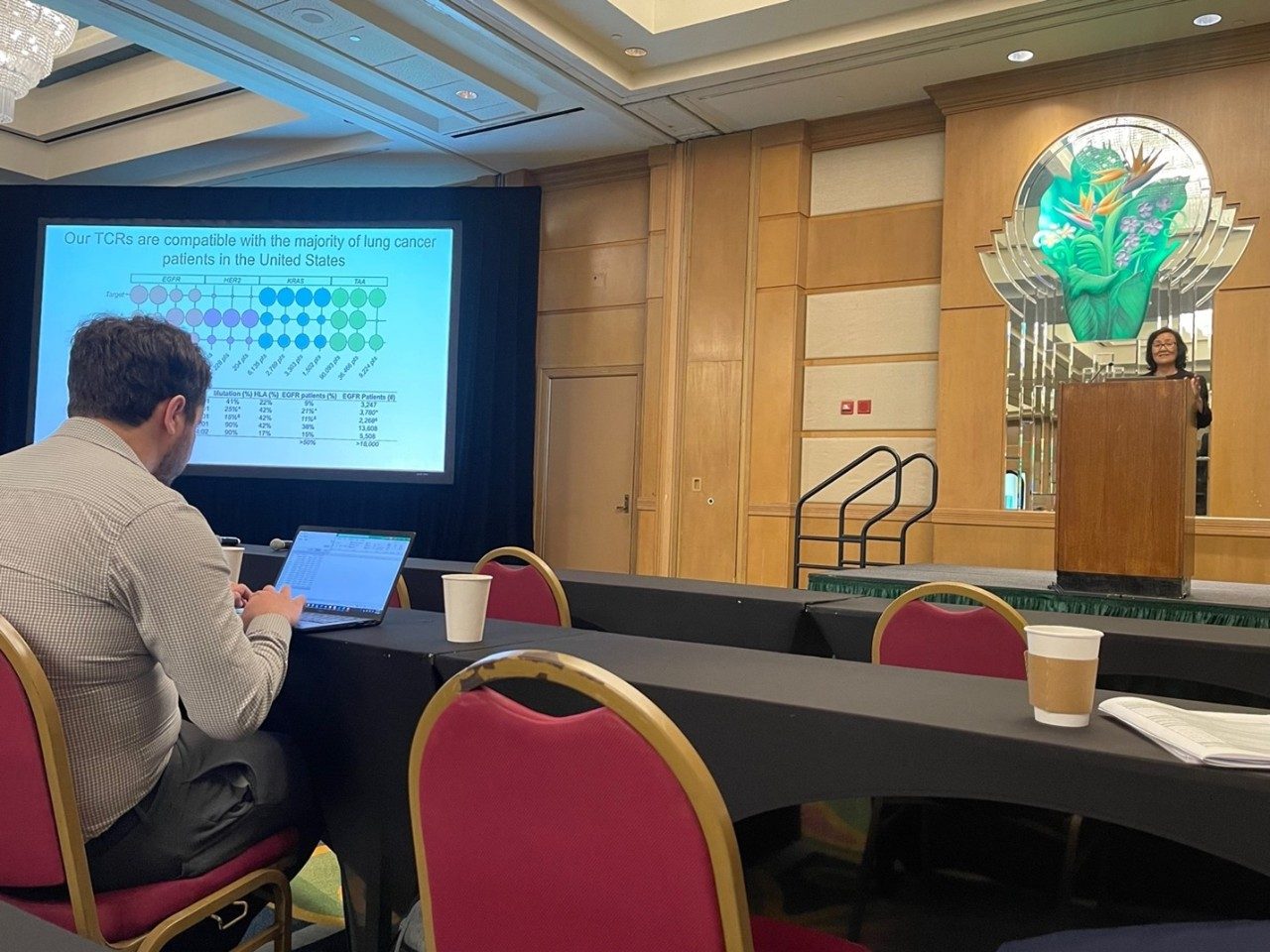 Minying onstage giving her talk