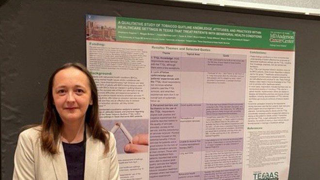 Women in front of a scientific poster