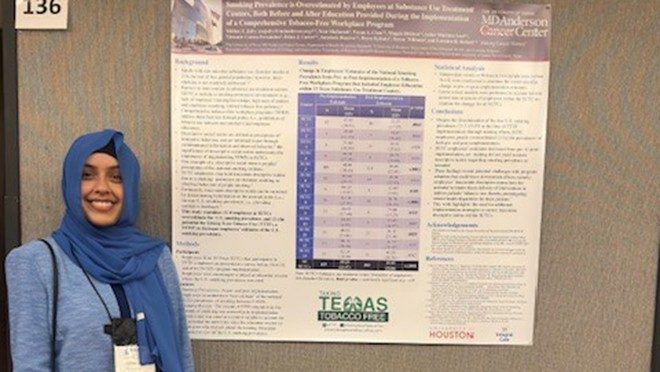 Women in front of a scientific poster