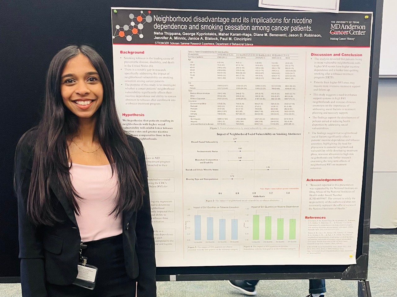 One person posed in front of a scientific poster