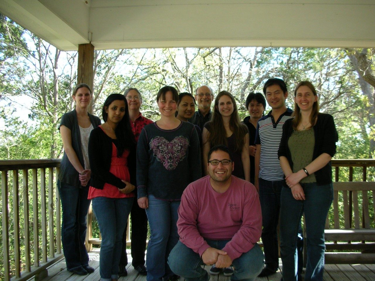 Wood Lab Group Photo, circa 2015, taken outside on a covered wooden deck