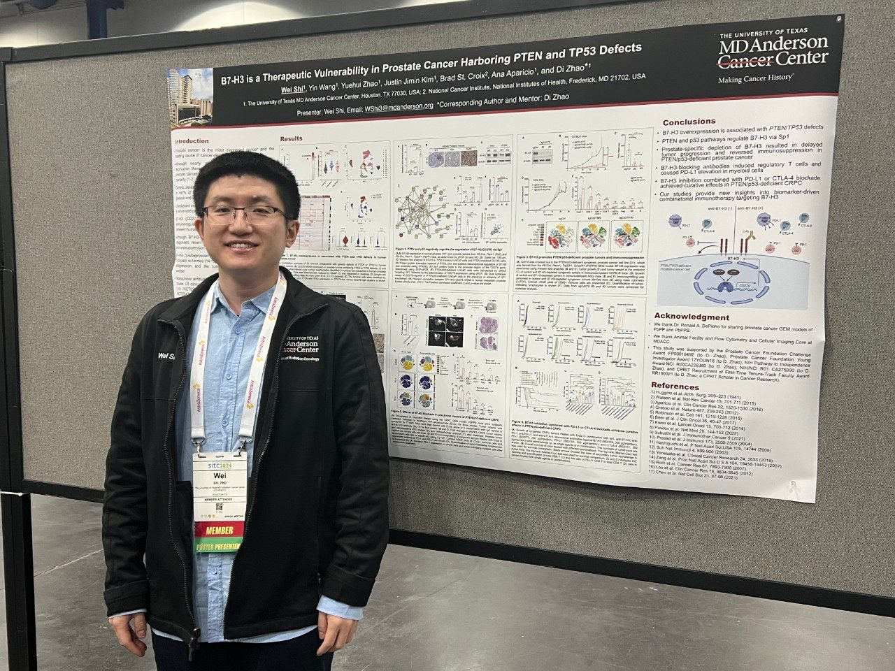 Man standing in front of poster board