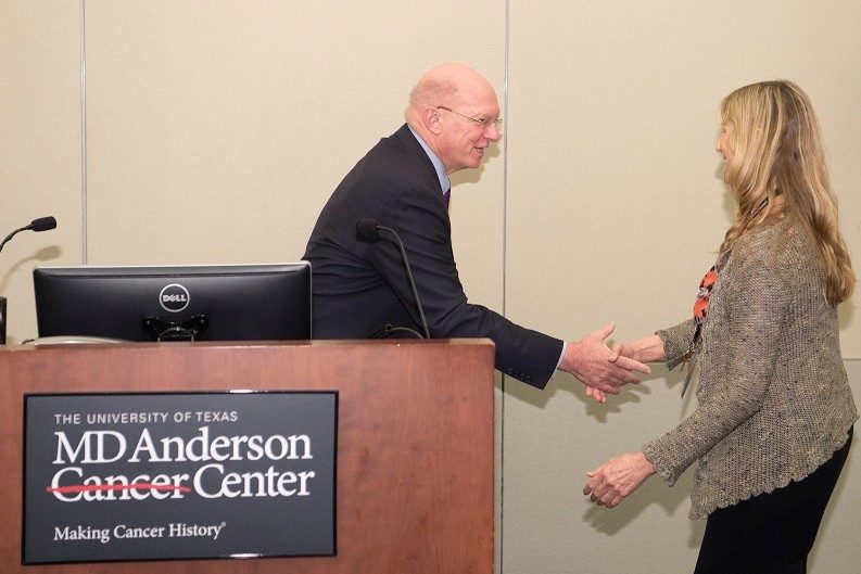 Dr. Janice Blalock accepts the Leading Mentor Award from Dr. Ernest Hawk, Vice President of Cancer Prevention