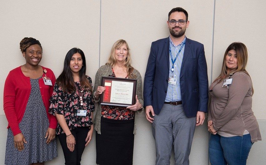 Leading Mentor Awardee, Dr. Janice Blalock (center) with Behavioral Science Research Team