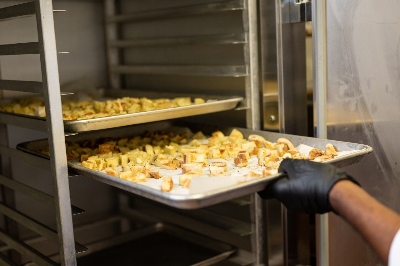 A tray of chicken being stored on a shelf in the research kitchen