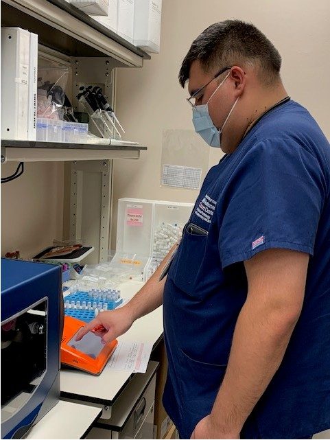 ITB lab member uses lab equipment